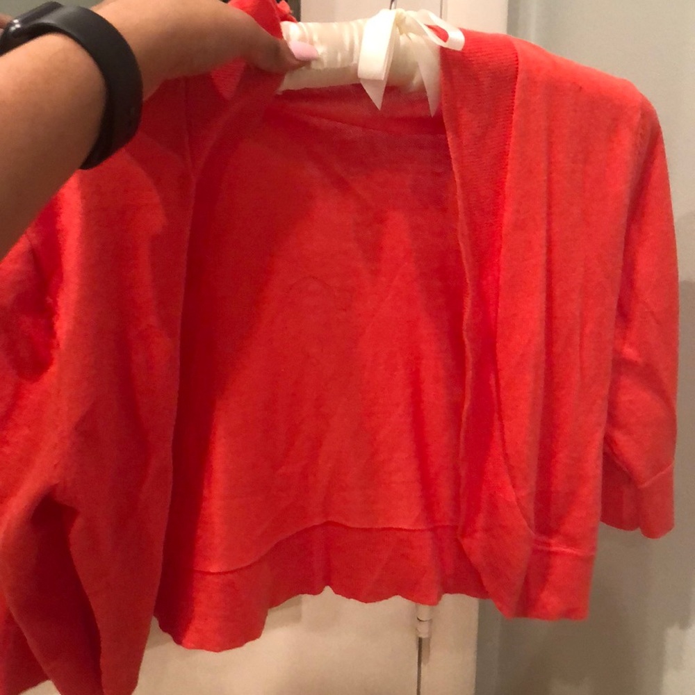 orange/pink cropped cardigan